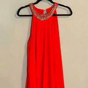 Reddish orange dress with bead decor on neckline